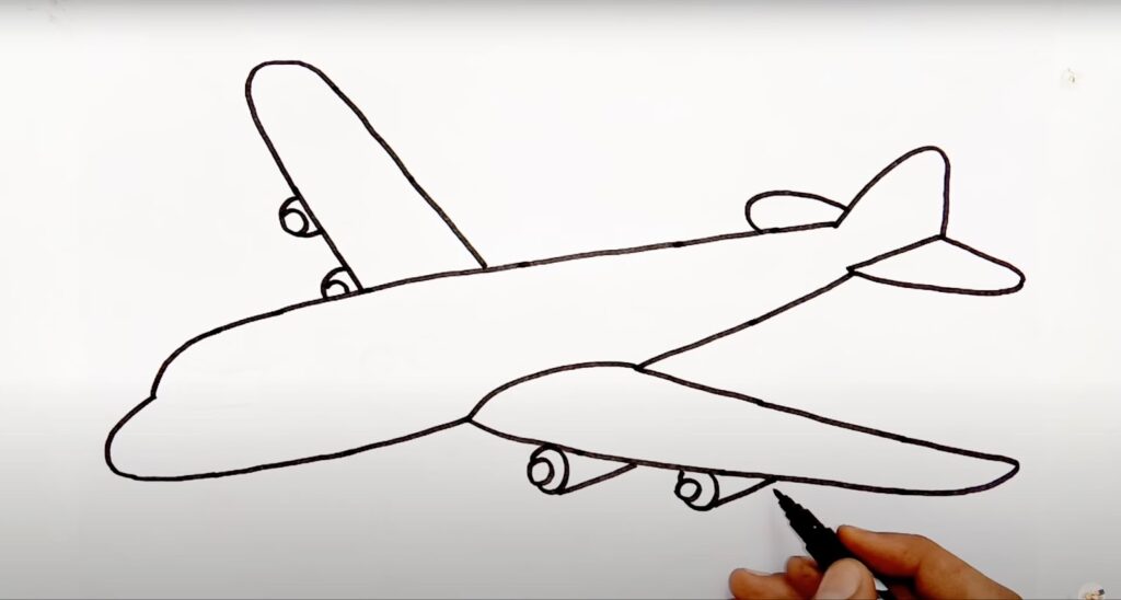 A man draws other wing and some detailing